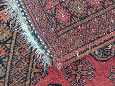 Lot 1301 - A Bokhara red ground wool runner, worked with...