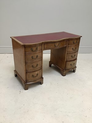 Lot 1206 - A mid 20th century walnut serpentine desk,...