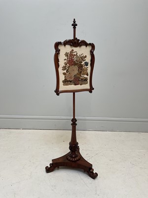 Lot 1262 - A Victorian rosewood pole screen, height 142cm.