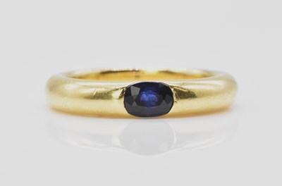 Lot 463 - A contemporary 18ct yellow gold sapphire ring,...