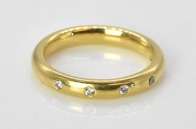 Lot 489 - A small 18ct yellow gold diamond set ring with...