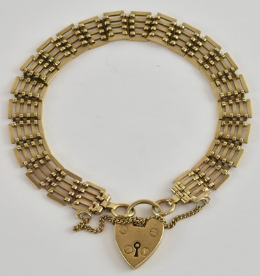 Lot 1340 - A 9ct yellow gold gate link bracelet, with...