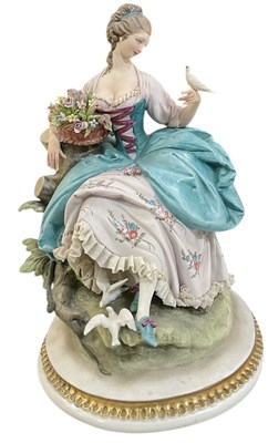 Lot 596 - CAPODIMONTE; a modern porcelain figure of a...