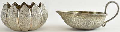 Lot 1117 - An Indian white metal porringer, with handle...