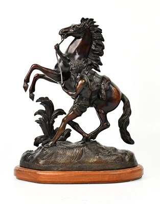 Lot 157 - COUSTEAU; a bronze Marly Horse on later wooden...