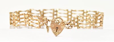 Lot 1410 - A 9ct gold four-bar gate bracelet with...