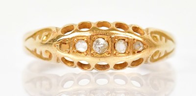 Lot 1292 - An 18ct yellow gold ring set with tiny white...