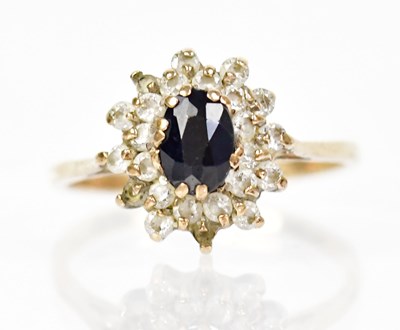 Lot 1337 - A 9ct gold ring set with floral cluster of...