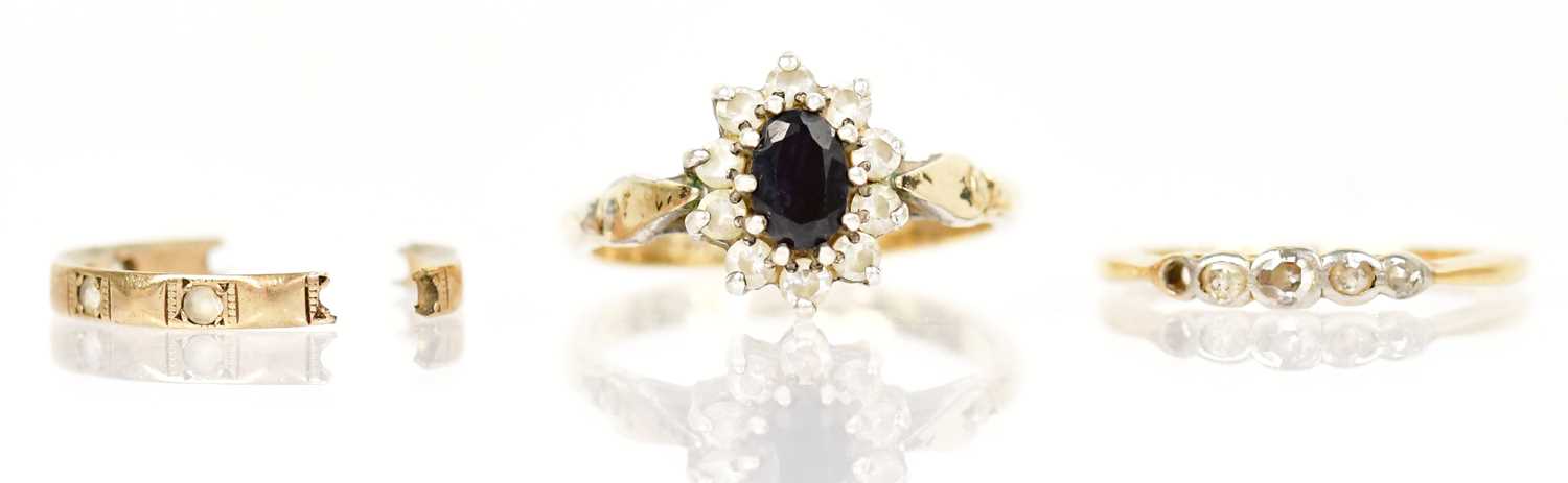 Lot 1359 - Two yellow metal rings, one with central blue...