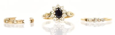 Lot 1359 - Two yellow metal rings, one with central blue...