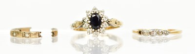 Lot 1359 - Two yellow metal rings, one with central blue...