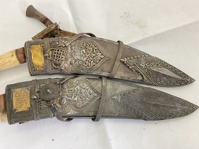 Lot 128 - A pair of ornately decorated kukri knives with...