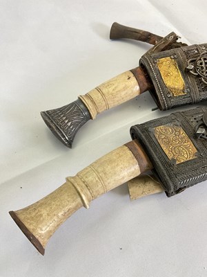 Lot 128 - A pair of ornately decorated kukri knives with...