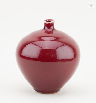Lot 721 - A globular stoneware vase covered in copper...