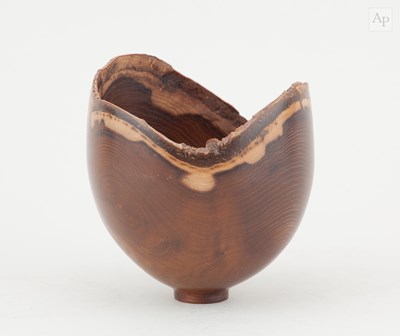 Lot 756 - A turned laburnum bowl with natural edge in...