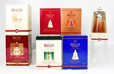 Lot 1035 - Six Bell's Wade Christmas whisky decanters,...