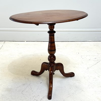 Lot 1179 - A 19th century mahogany oval tripod table,...