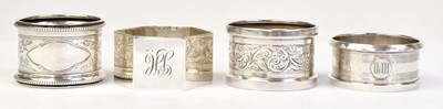 Lot 1110 - Four hallmarked silver napkin rings, all...