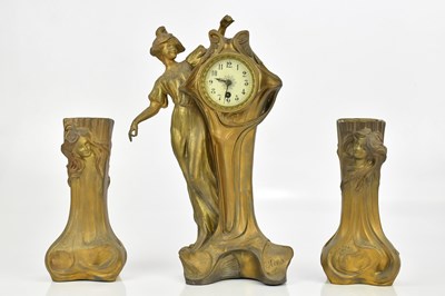 Lot 73 - An Art Nouveau bronzed spelter three-piece...