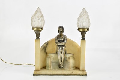 Lot 61 - An Art Deco silvered metal and carved...