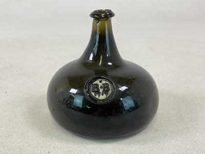 Lot 2 - A rare sealed onion wine bottle dated 1717 of...