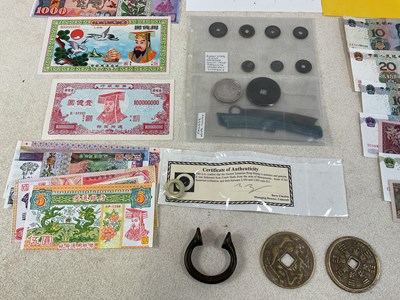 Lot 574 - A small group of coins and banknotes...