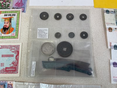 Lot 574 - A small group of coins and banknotes...