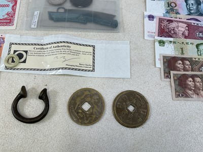 Lot 574 - A small group of coins and banknotes...