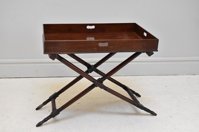 Lot 1150 - A Victorian mahogany butler's tray on folding...