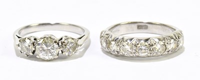 Lot 1032 - An 18ct yellow gold and seven stone diamond...