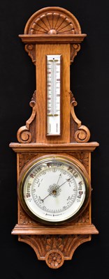 Lot 103 - An early 20th century oak aneroid...