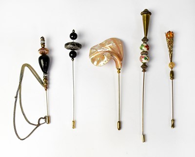Lot 487 - Five vintage hat pins, to include beaded...