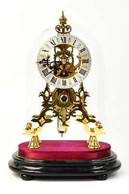 Lot 85 - A reproduction brass skeleton clock, the...
