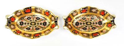 Lot 129 - ROYAL CROWN DERBY; a pair of Imari pin dishes...