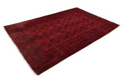 Lot 1303 - A large Bokhara type red ground rug, with...