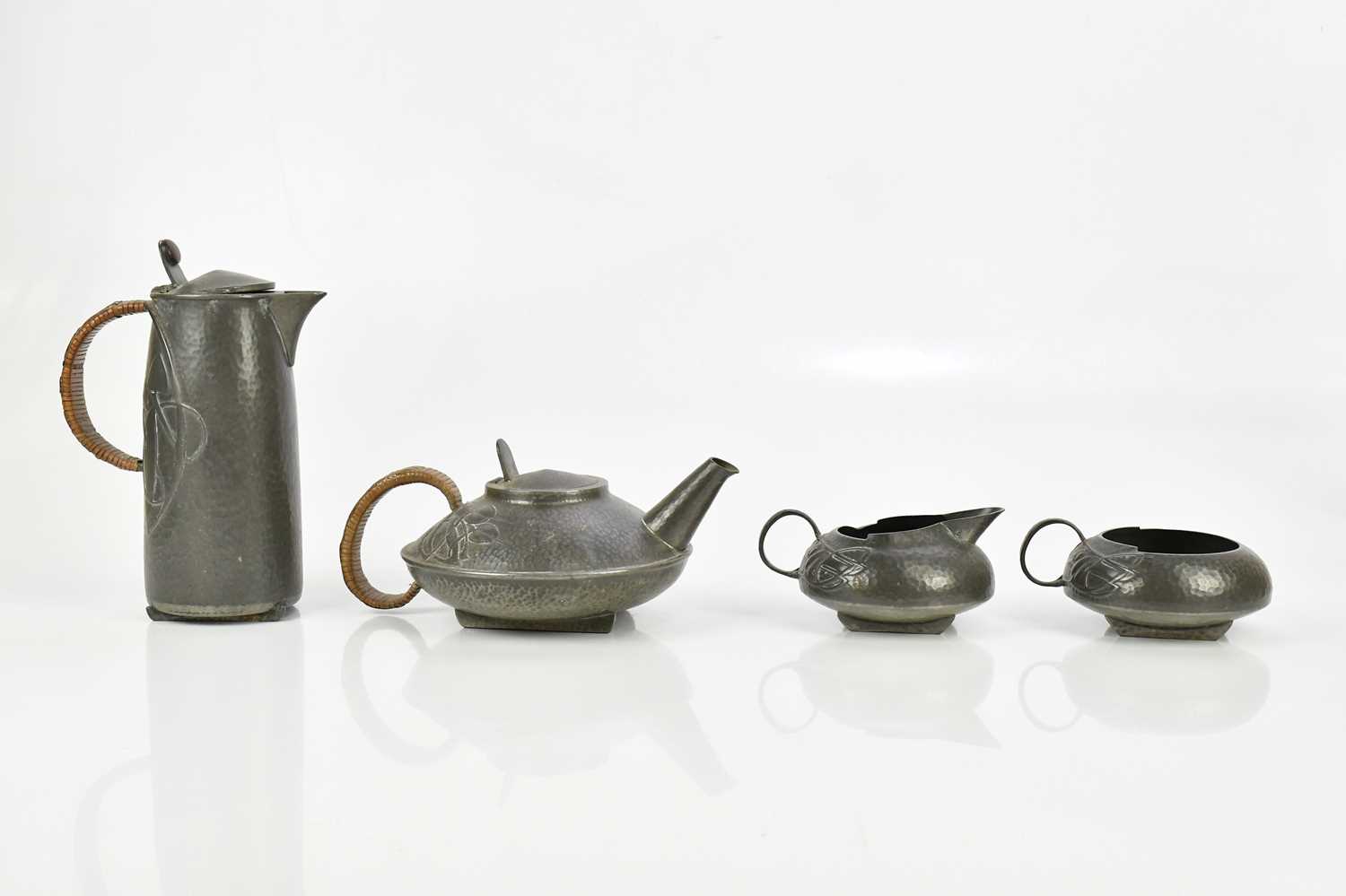 Lot 47 - ARCHIBALD KNOX FOR TUDRIC PEWTER; a four piece...