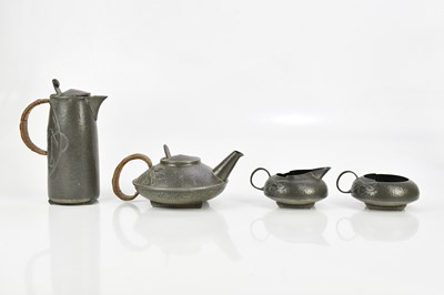 Lot 47 - ARCHIBALD KNOX FOR TUDRIC PEWTER; a four-piece...