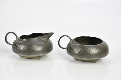 Lot 47 - ARCHIBALD KNOX FOR TUDRIC PEWTER; a four piece...