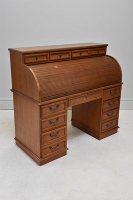 Lot 1135 - A reproduction roll top desk, with an...