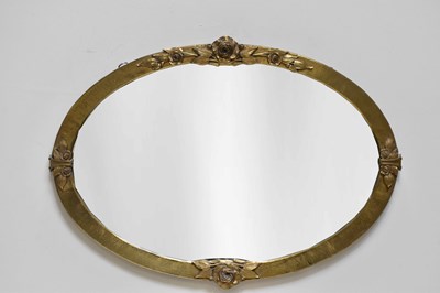 Lot 1017 - A sheet brass Arts and Crafts style oval wall...