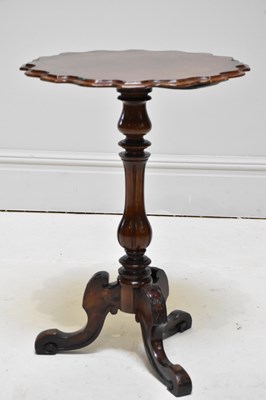 Lot 1184 - A Victorian walnut tripod table with scalloped...