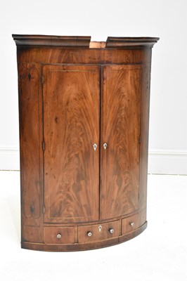 Lot 1250 - A 19th century mahogany bowfront corner...
