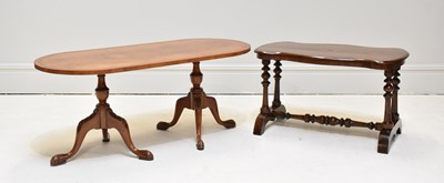 Lot 1134 - A reproduction walnut twin pedestal coffee...