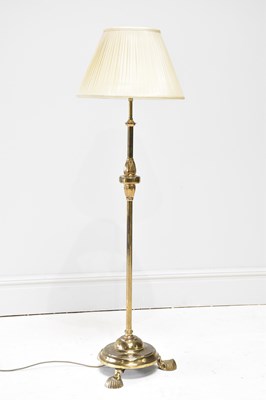 Lot 1682 - A brass standard lamp, with circular base and...