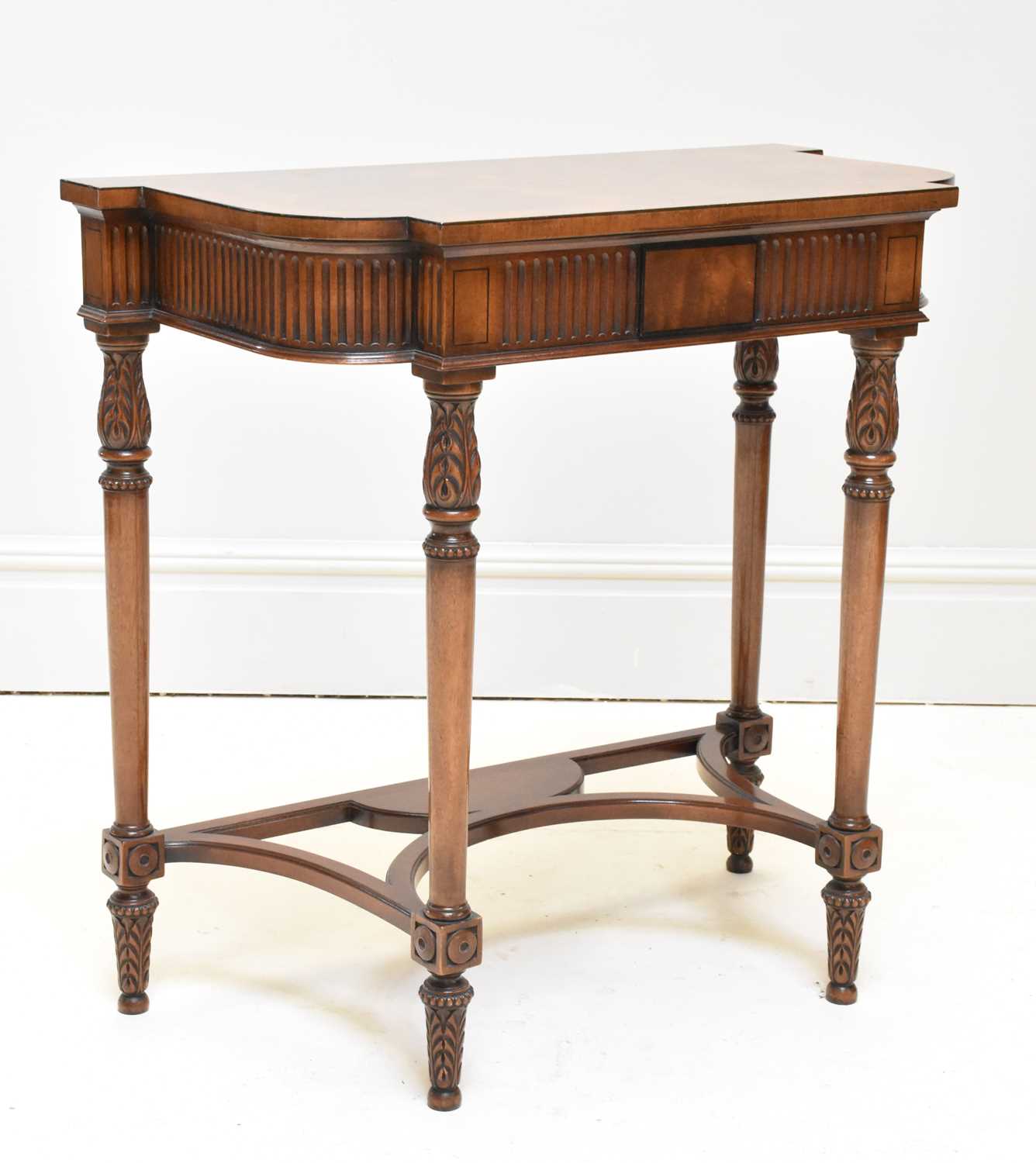 Lot 1119 - A reproduction carved walnut hall table,