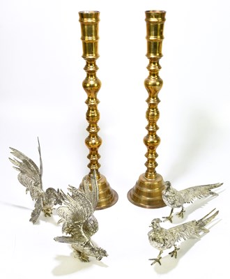 Lot 275 - A pair of decorative brass candlesticks,...