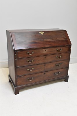Lot 1214 - A George III mahogany bureau, the fall front...