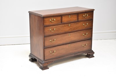 Lot 1176 - A Georgian mahogany chest of three short over...