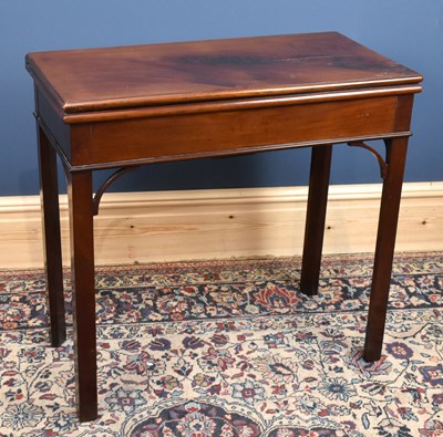 Lot 2856 - A 19th century mahogany fold over games table...