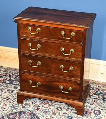 Lot 2858 - A small mahogany chest of four drawers with...